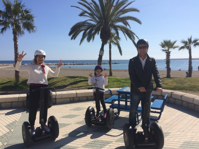On a segway in front of the beach promenade 